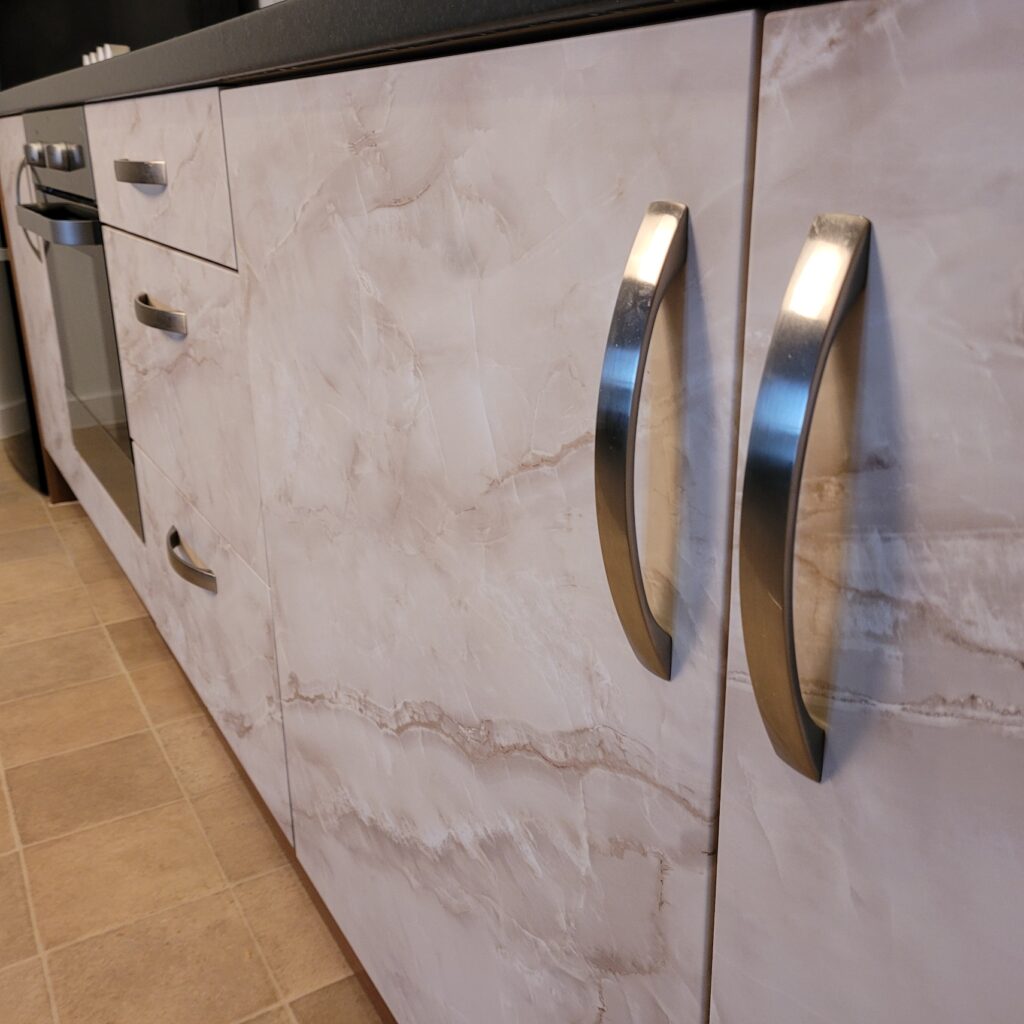 close up view of freshly vinyl wrapped kitchen cupboard doors