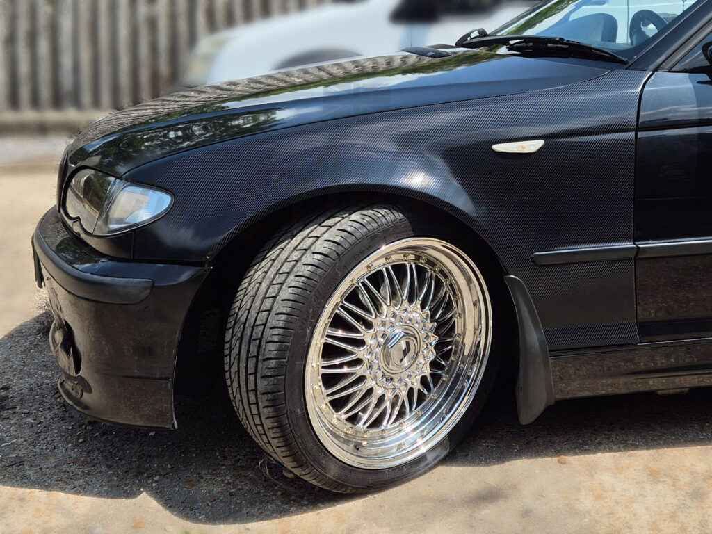BMW front wing wrapped with a glossy 6D 'carbon-effect' automotive vinyl wrapping film